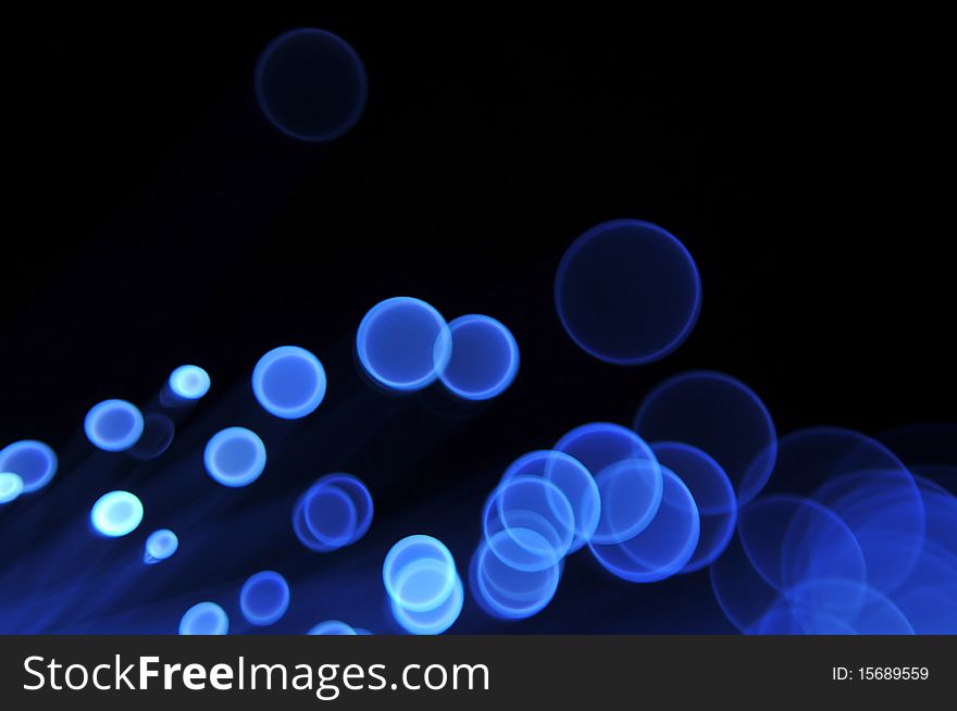 A blurry defocused background with round glowing circles as the bokeh shape. A blurry defocused background with round glowing circles as the bokeh shape