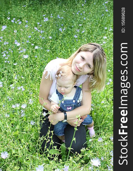 Mother and daughter on the grass