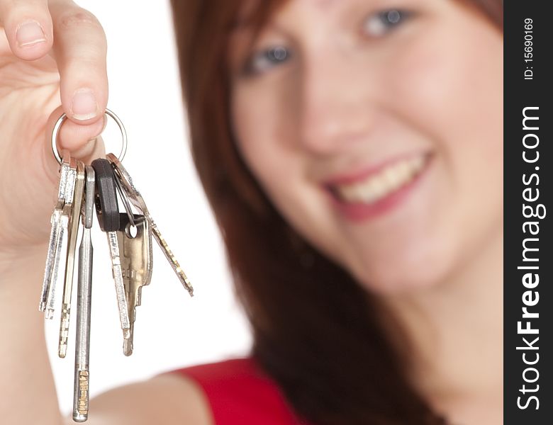 Young and nice woman holding keys