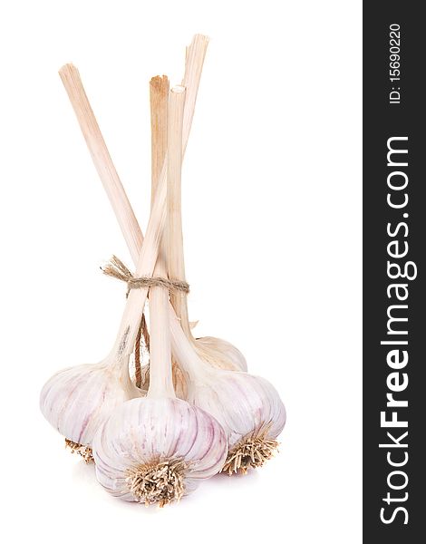 Vertical image of isolated garlics