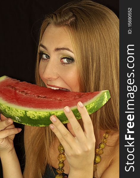 Portrait of a beautiful sexual girl with watermelon in his hands, isolation on a black background. Portrait of a beautiful sexual girl with watermelon in his hands, isolation on a black background