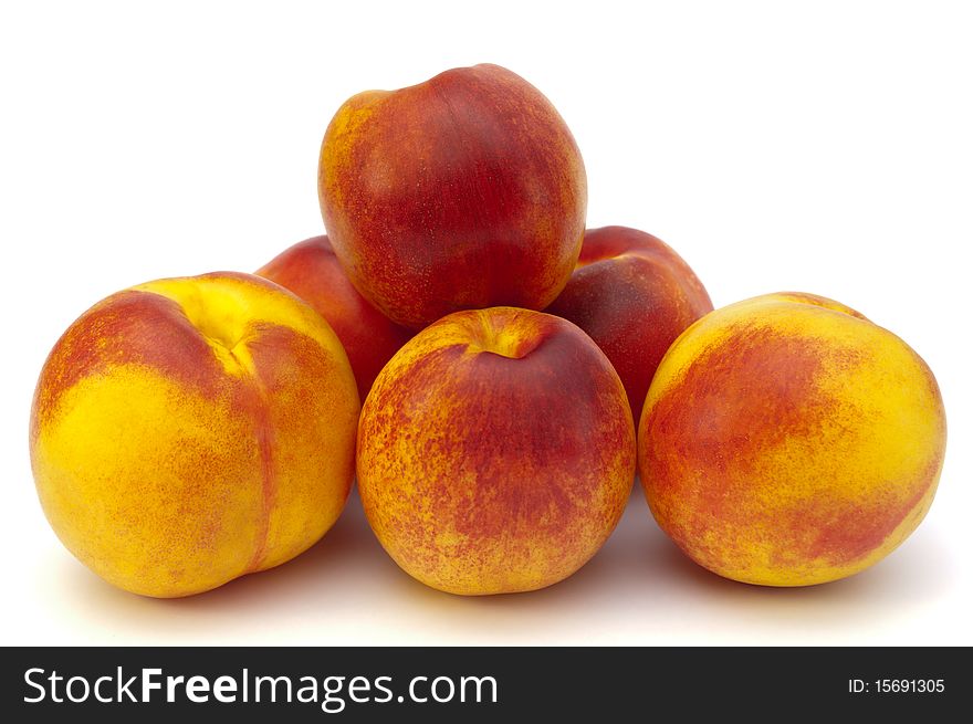 Peaches on a white. red, yellow peaches