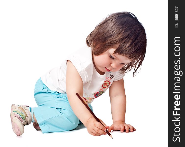 Little girl draws. Isolated on white