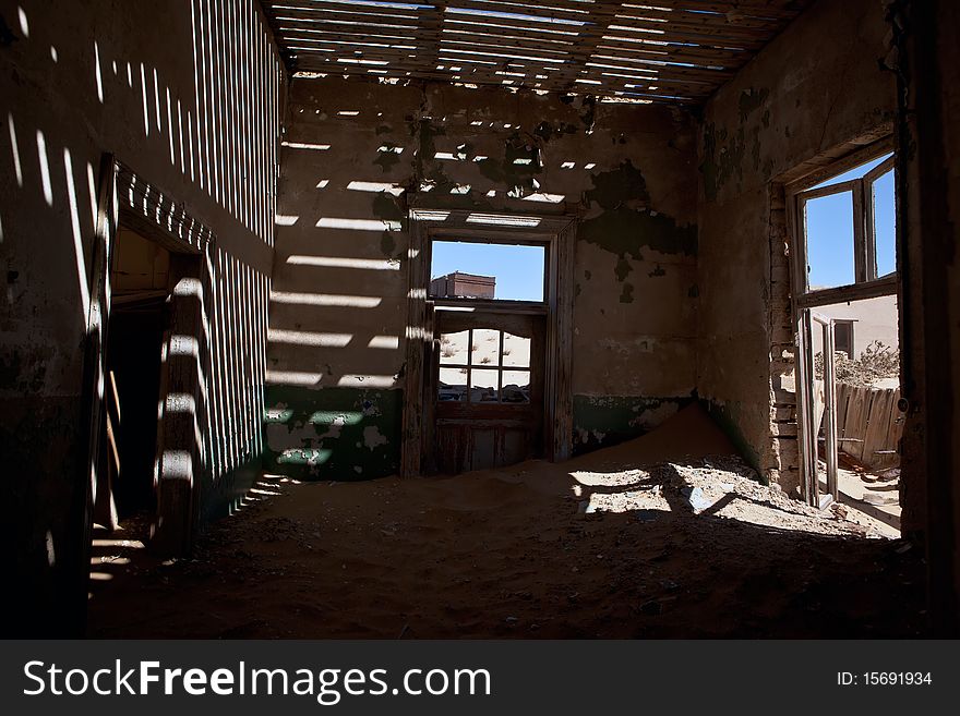 Old ruin in the abandoned diamond town Kolmanskop in Namibia