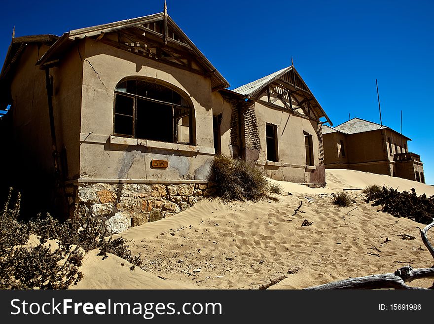 Old ruin in the abandoned diamond town Kolmanskop in Namibia