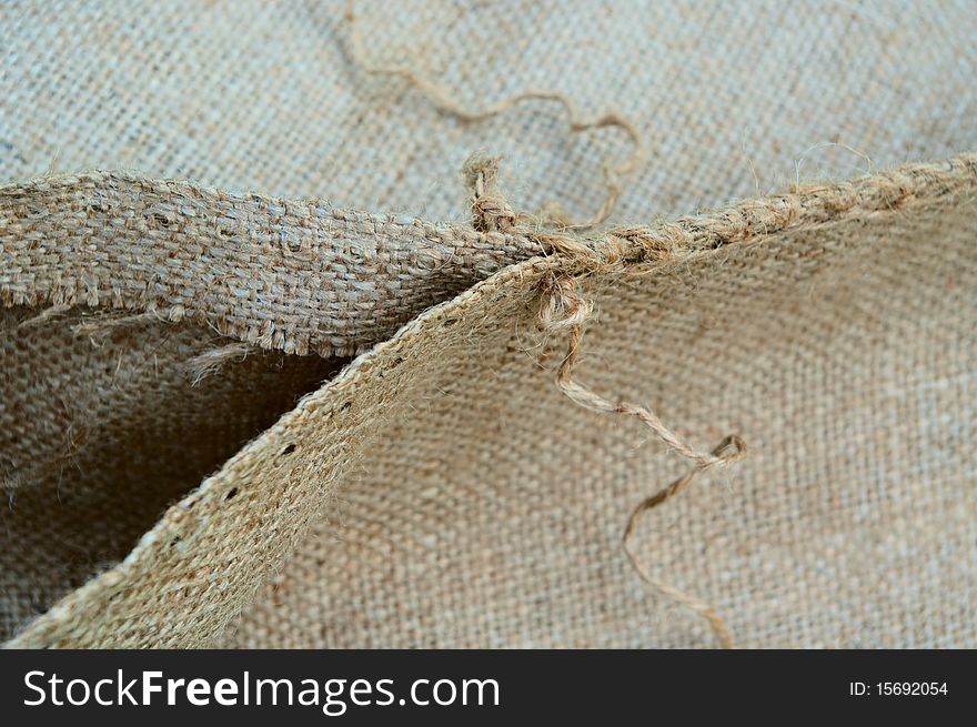 Open jute bag with thread. Open jute bag with thread.