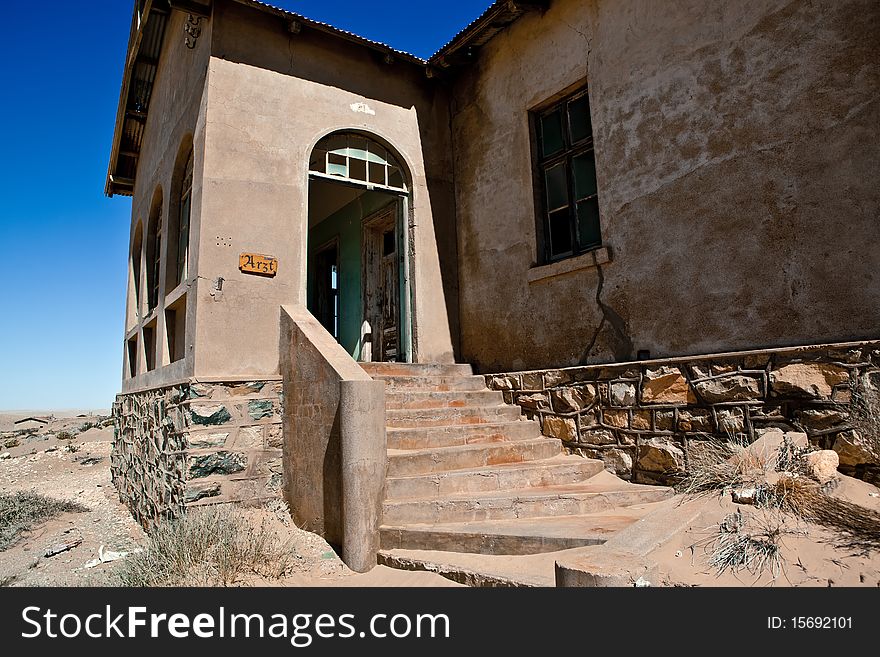 Old ruin in the abandoned diamond town Kolmanskop in Namibia