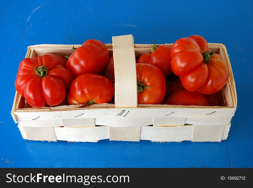 Fresh red Tomatoes in Basket