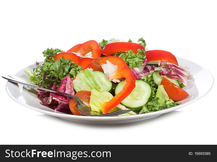 Salad with vegetables on white background