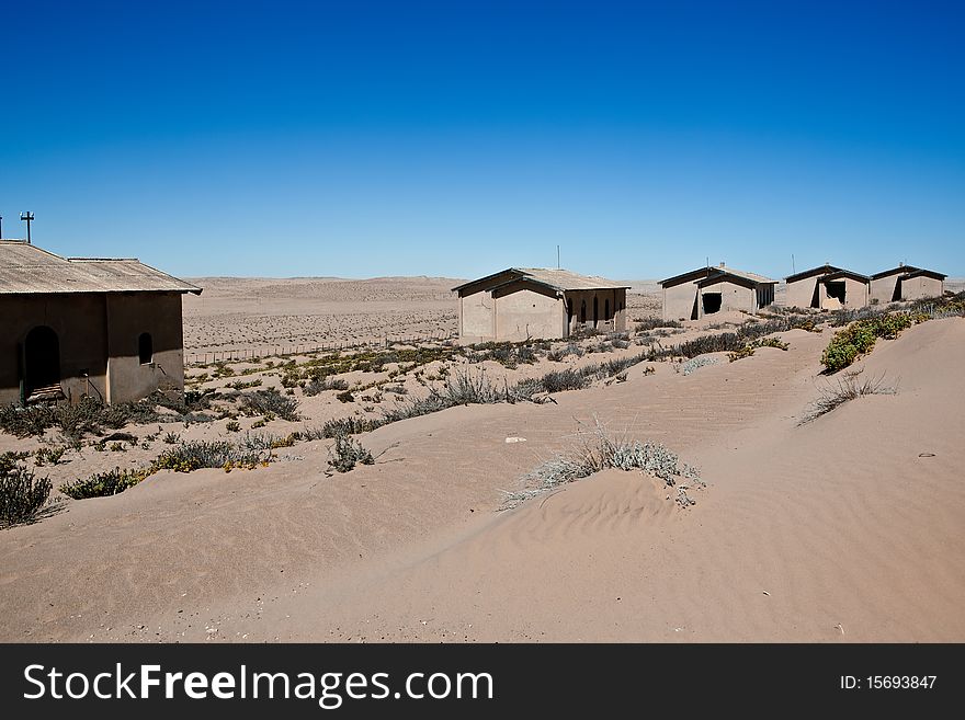 Old ruin in the abandoned diamond town Kolmanskop in Namibia