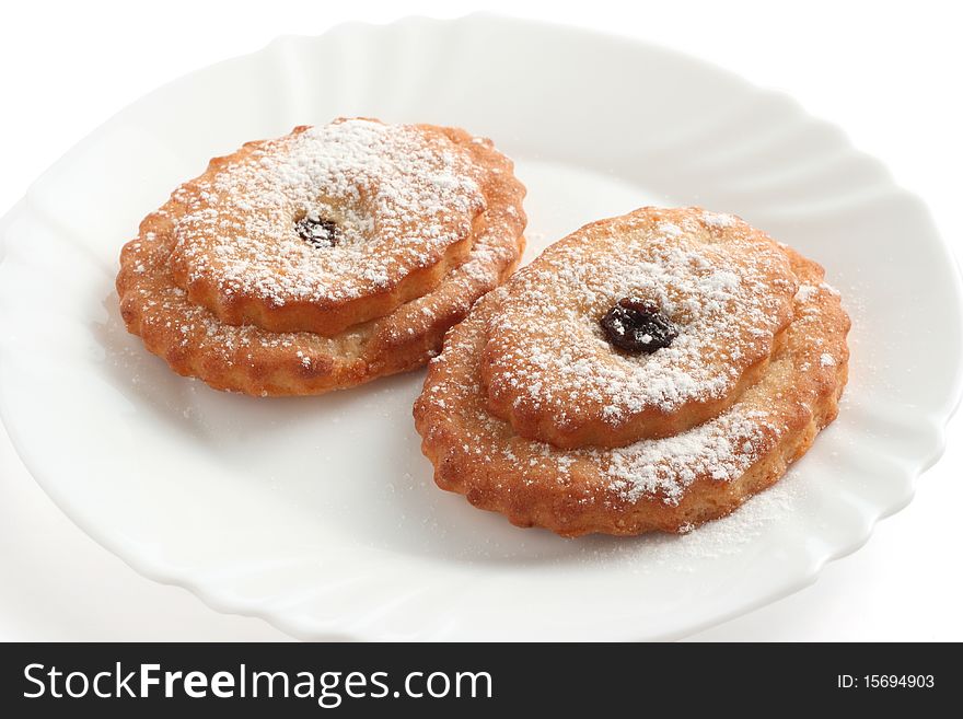 Cookies with castor sugar on a plate. Cookies with castor sugar on a plate