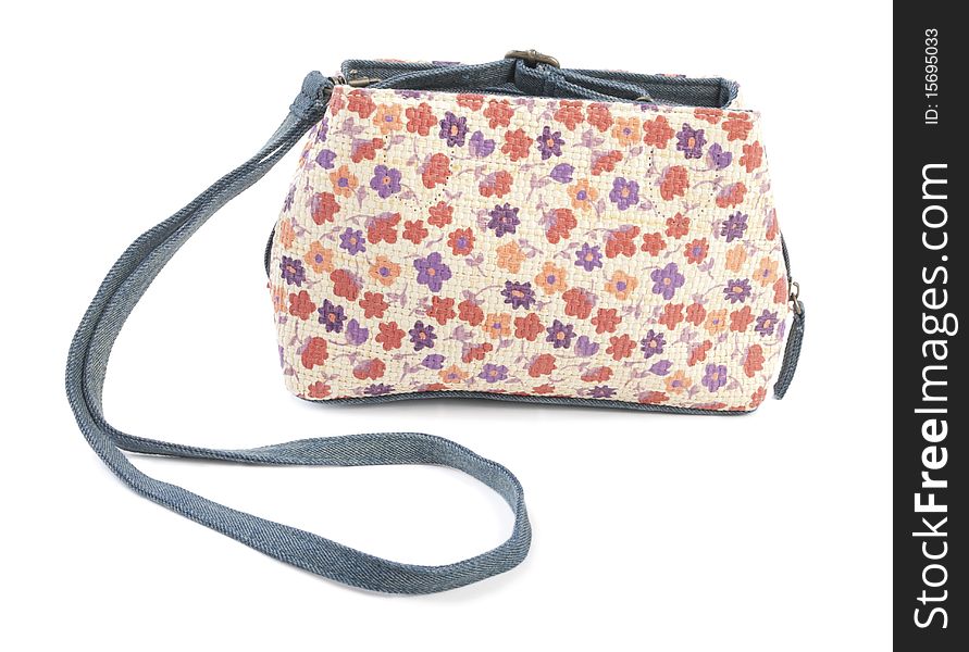 Textile female bag with floral ornament. Isolated on white background. Textile female bag with floral ornament. Isolated on white background