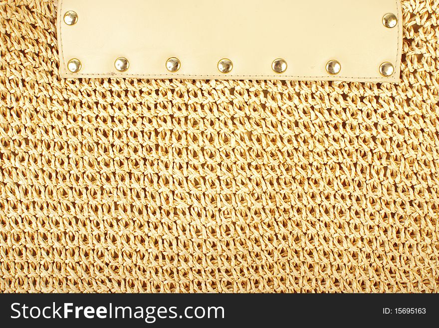 Knitted textile texture with lether element and rivets. Knitted textile texture with lether element and rivets