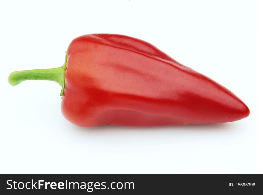 One red hot pepper on a white background. One red hot pepper on a white background