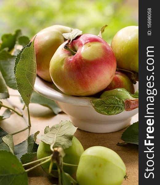 Bowl of fresh ripe apples on table. Bowl of fresh ripe apples on table