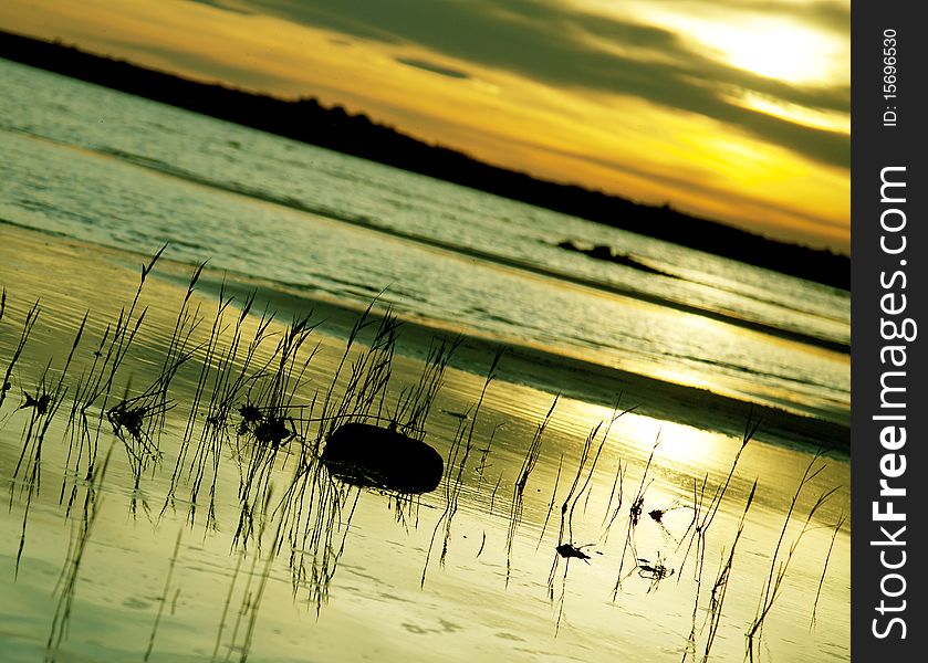 Beautiful sunset on a remote and wild beach. Beautiful sunset on a remote and wild beach