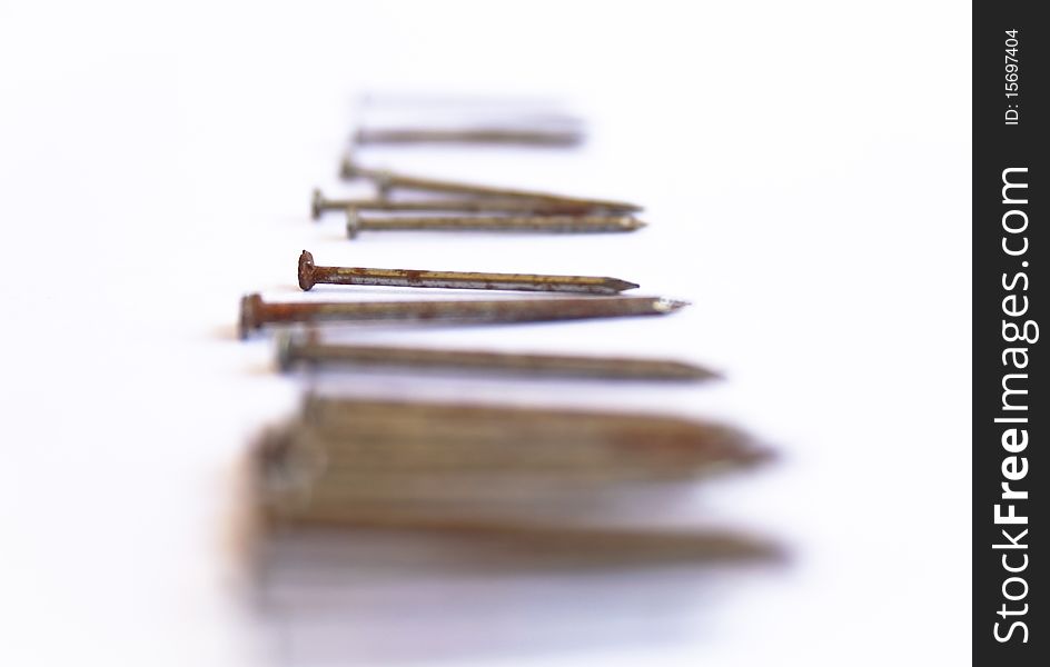 Several nails rust on a white background. Several nails rust on a white background.