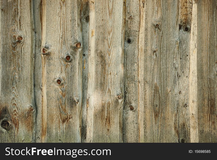 Old weathered wooden fence background. Old weathered wooden fence background
