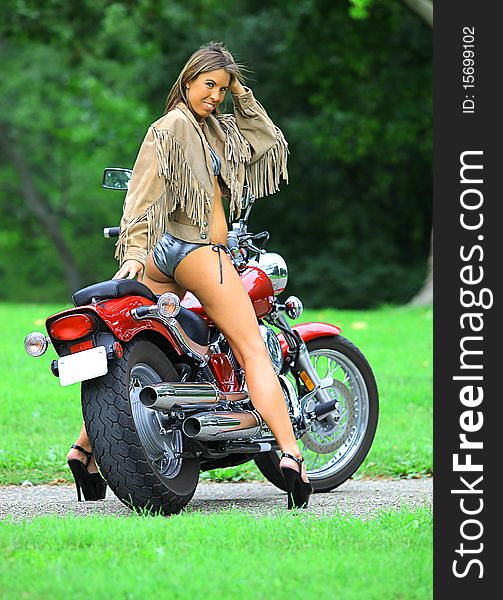 a woman on a motorcycle. a woman on a motorcycle