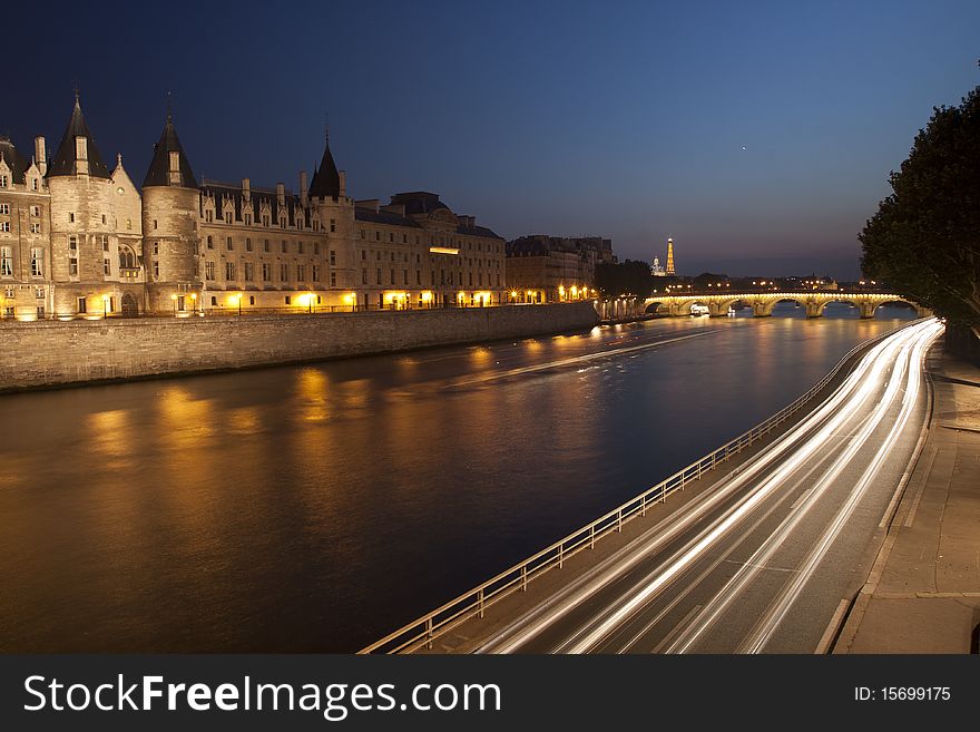Night Shot of the Seine river in Paris with the historic Cite in the back. Night Shot of the Seine river in Paris with the historic Cite in the back