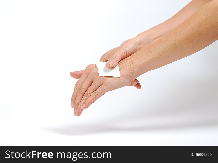 Female hand massages her hand isolated on white