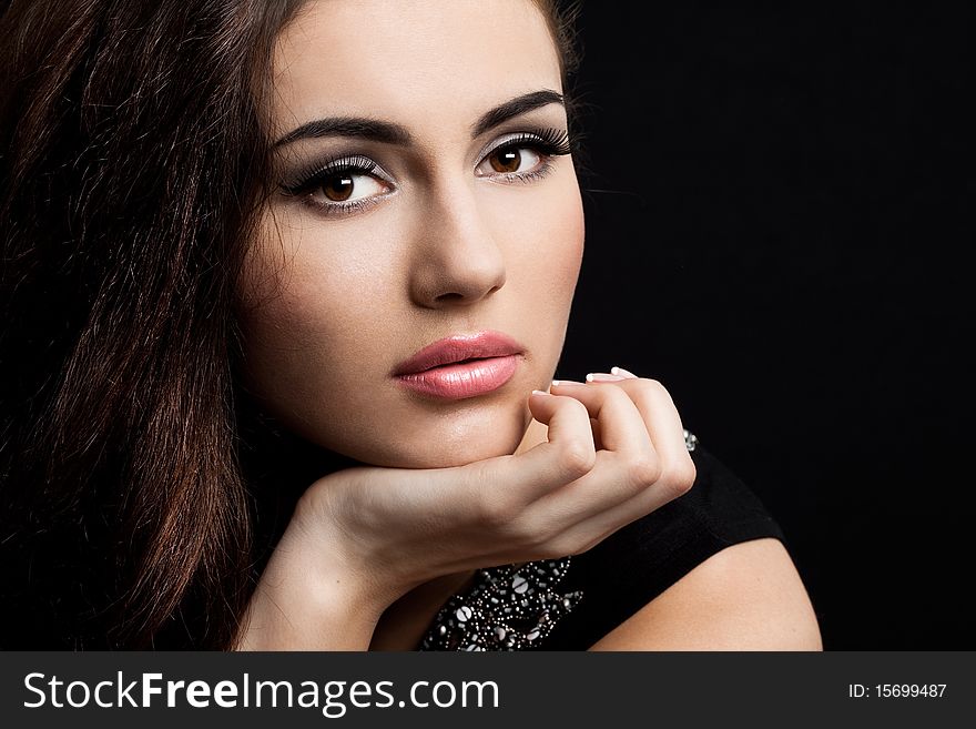 Beautiful fashioned woman on black background