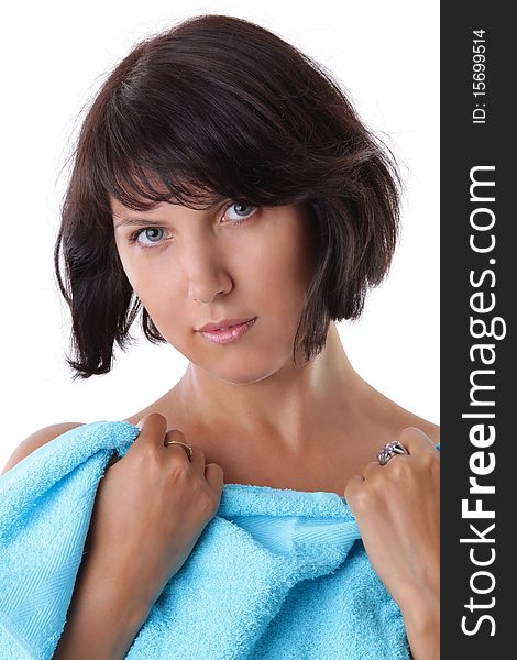 Portrait of a beautiful woman with a blue towel after bath. Portrait of a beautiful woman with a blue towel after bath
