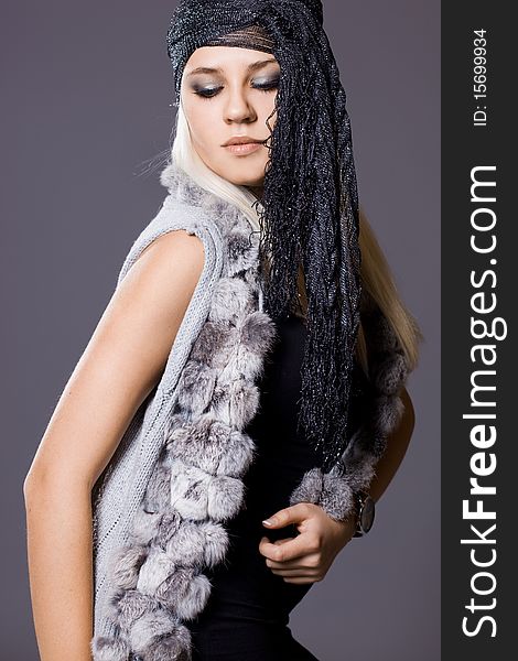 fashionable woman with fur waistcoat. fashionable woman with fur waistcoat