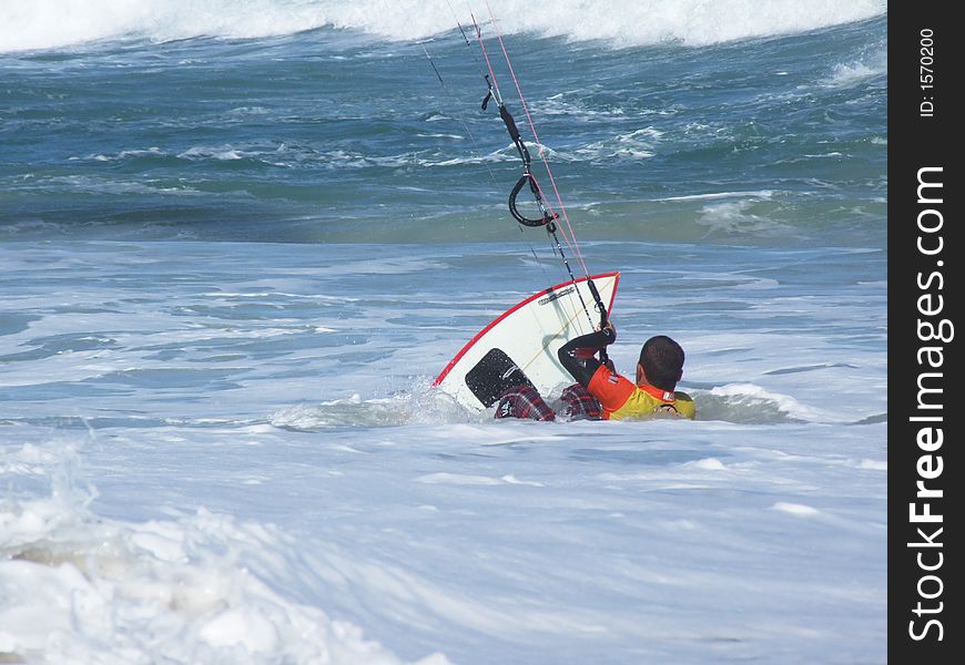 Kite surfer in the waves - Brazil. Kite surfer in the waves - Brazil