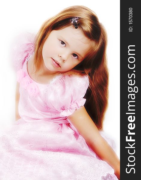 Happy little princess with a beautiful hair. Shot in studio. Happy little princess with a beautiful hair. Shot in studio.