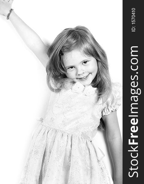 Happy little princess with a beautiful hair. Shot in studio. Happy little princess with a beautiful hair. Shot in studio.