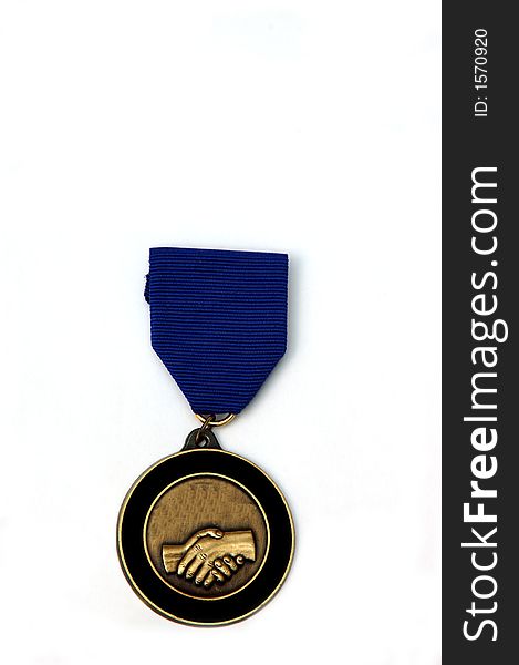 A medal awarded for co-operation against a white background. A medal awarded for co-operation against a white background