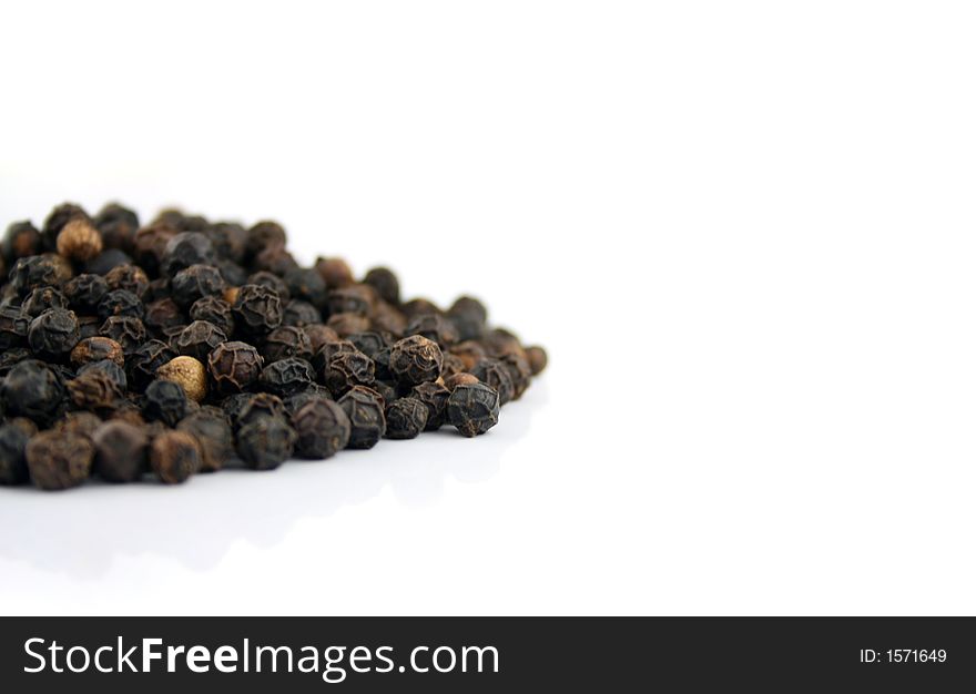 Close up of Black Mustard Seeds on a white background. Close up of Black Mustard Seeds on a white background