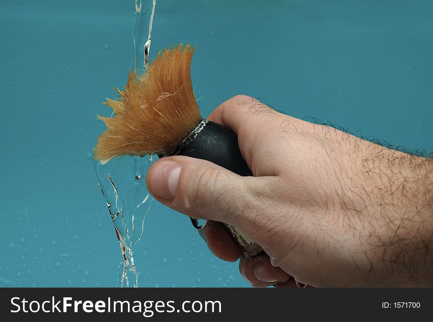 Shaving brush under pouring water. Shaving brush under pouring water