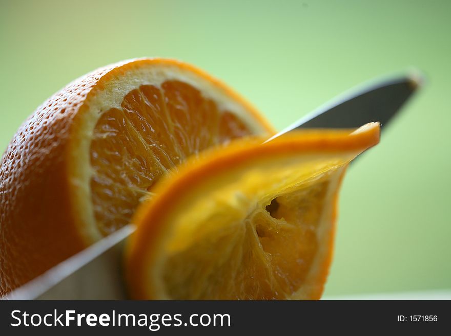 Close up of orange being sliced. Close up of orange being sliced