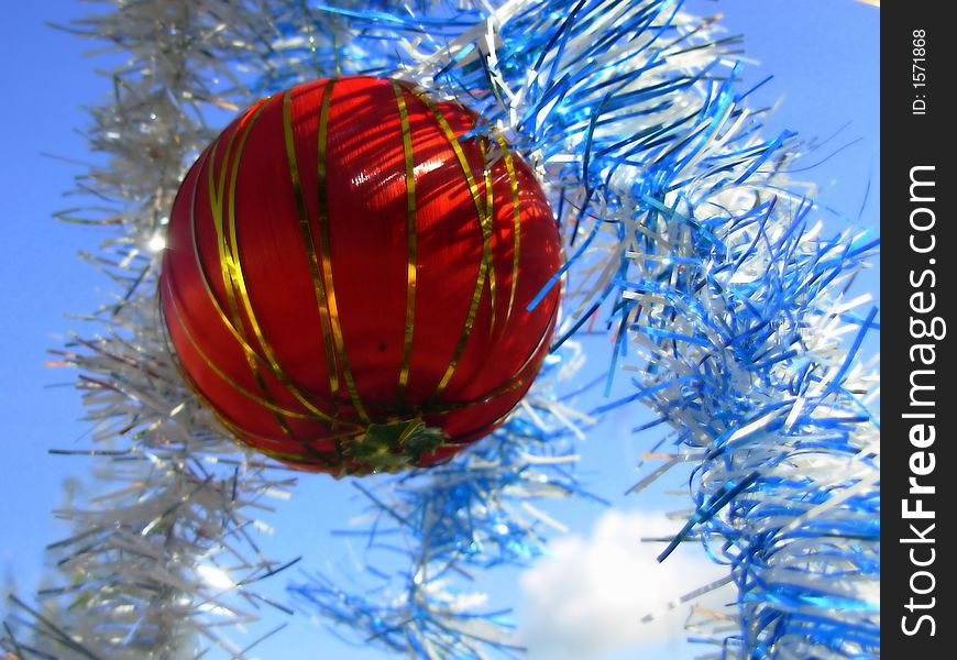 Colorful Christmas balls in blue sky spreaded all over the frame. Colorful Christmas balls in blue sky spreaded all over the frame