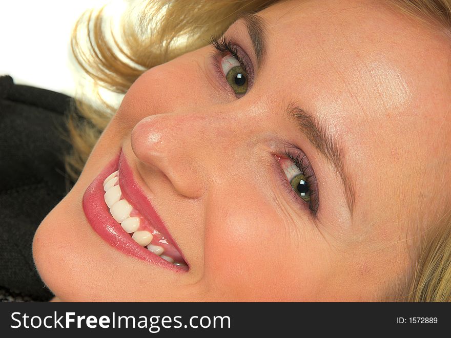 Horisontal close up of blond girl smiling. Horisontal close up of blond girl smiling