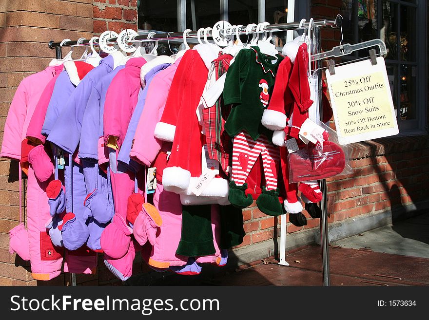 Holiday sidewalk sale at Children’s clothing store.