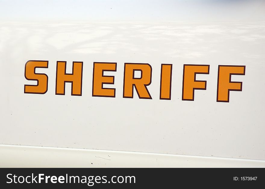 The white door of a sheriff car