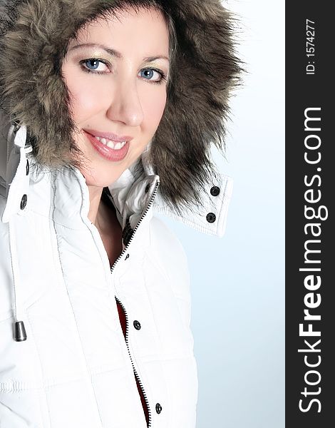 Adult woman wearing a fur trimmed hooded parka. Adult woman wearing a fur trimmed hooded parka