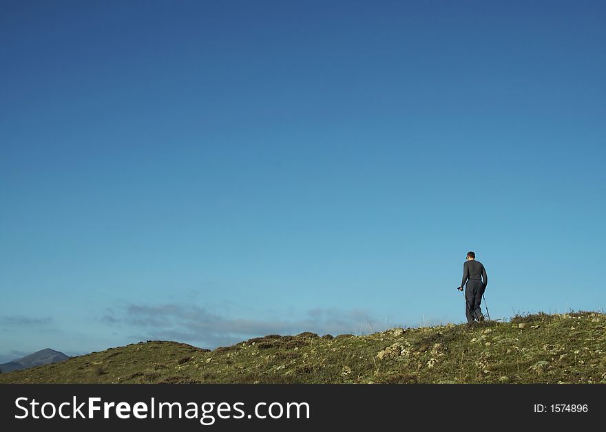 Men going up on the green hill. Men going up on the green hill