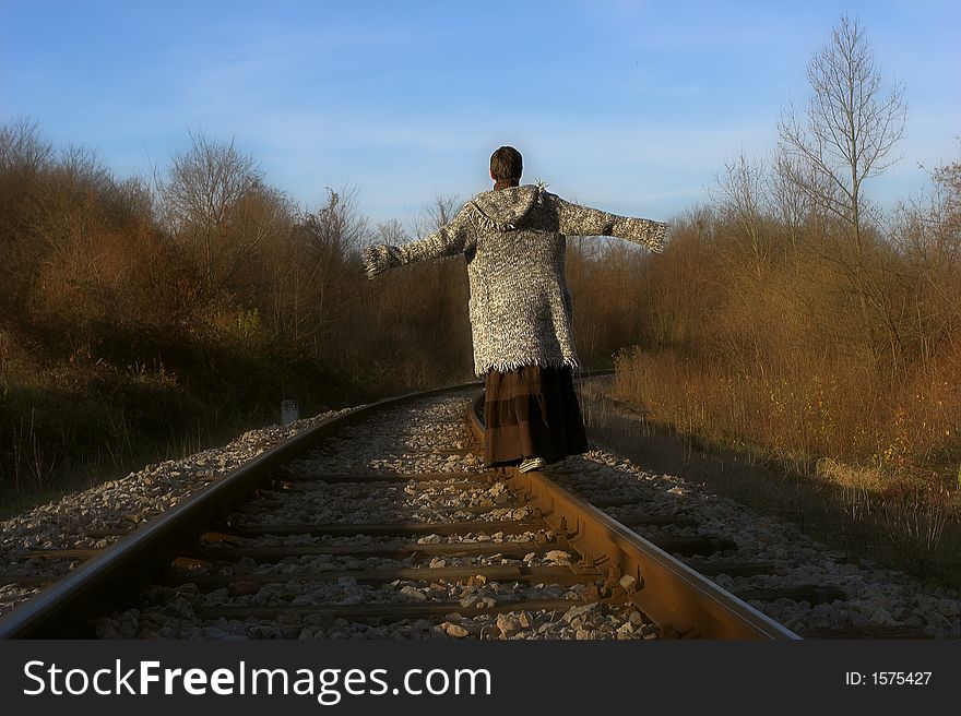 Woman is walking on the train trail. Woman is walking on the train trail