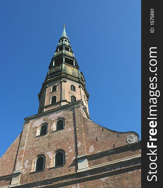 St. Peter cathedral spire. This church is the oldest in Latvia. It used to be the main cathedral during the middle ages for the inhabitants of Riga (Latvia). St. Peter cathedral spire. This church is the oldest in Latvia. It used to be the main cathedral during the middle ages for the inhabitants of Riga (Latvia).