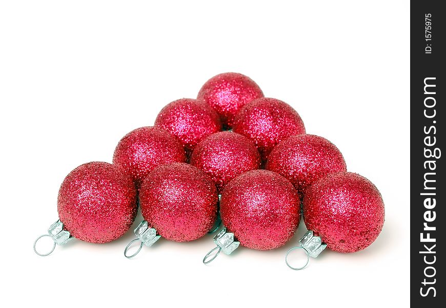 Pyramid of red glistering christmas balls over white background. Pyramid of red glistering christmas balls over white background