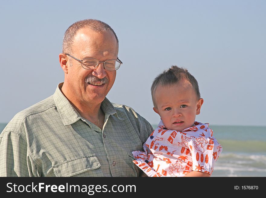 Grandfather and grandson at beach on vacation in southwest Florida