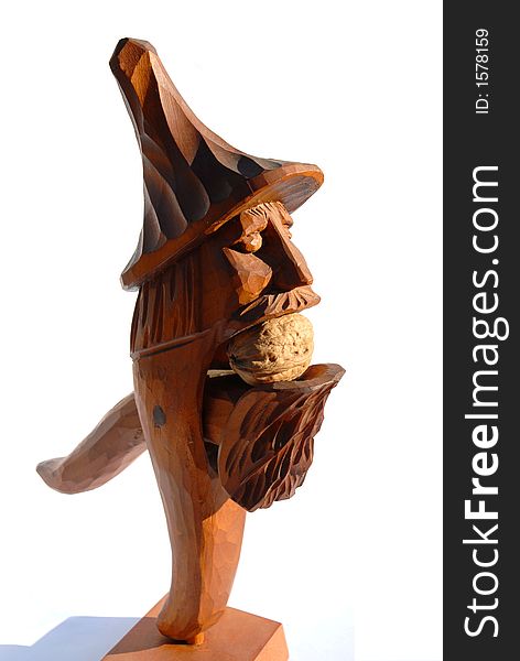 Nutcracker in shape of folk sculpture with walnut inside. Nutcracker in shape of folk sculpture with walnut inside