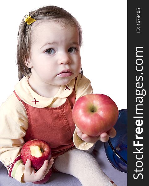 Little cute girl with two apples. Isolated on white background. Little cute girl with two apples. Isolated on white background