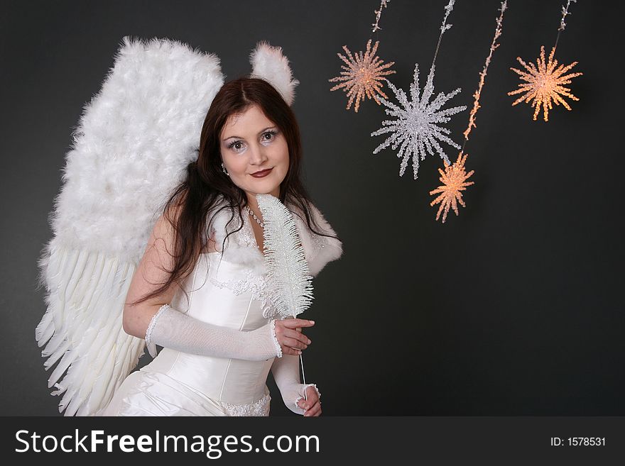 Smiling white Angel with three crystal stars. Smiling white Angel with three crystal stars