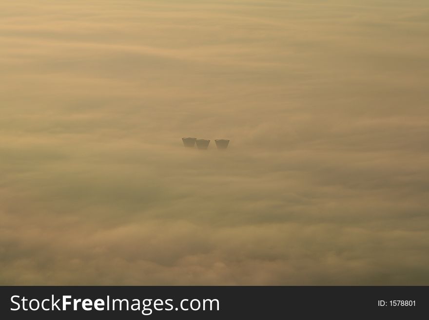 Water towers in the fog