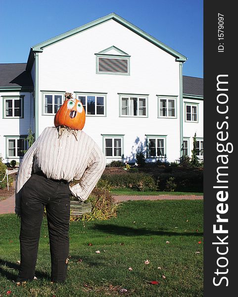 Pumpkin Person In Front Of A House